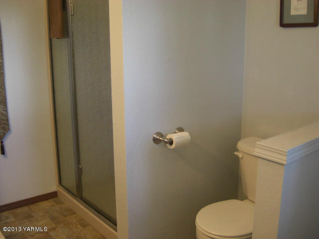 13907 Fisk Road Yakima, WA 98908 - Photo 20 of 55 a white toilet sitting next to a shower