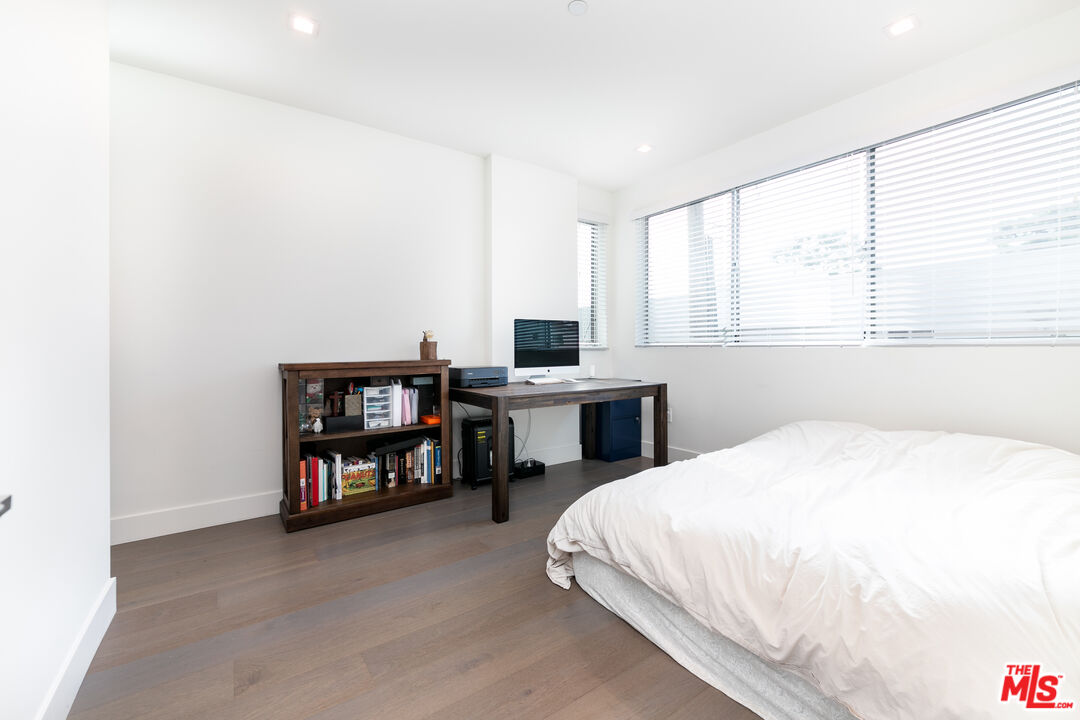 1951 Manning Avenue Los Angeles, CA 90025 - Photo 11 of 27 a bed room with a bed and a book shelf
