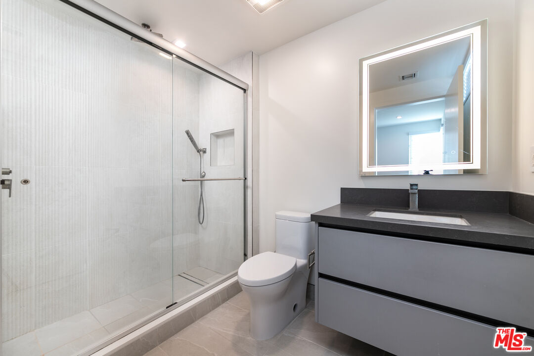 1951 Manning Avenue Los Angeles, CA 90025 - Photo 14 of 27 a bathroom with a sink toilet and shower