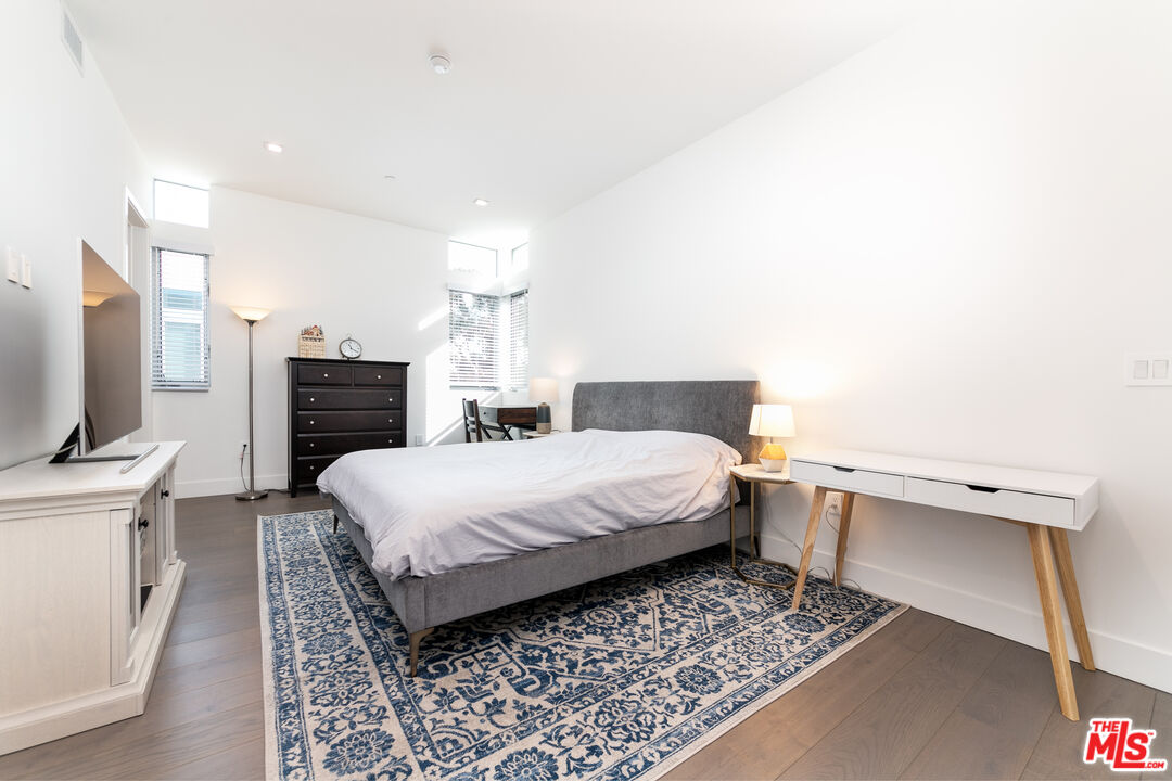 1951 Manning Avenue Los Angeles, CA 90025 - Photo 16 of 27 a bed room with a bed and a television