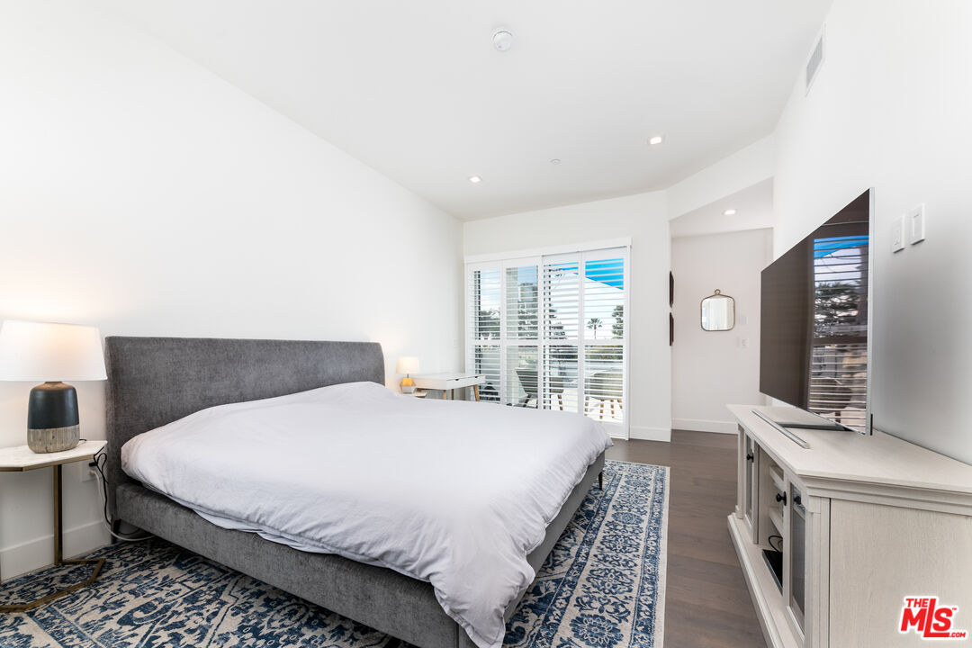 1951 Manning Avenue Los Angeles, CA 90025 - Photo 17 of 27 a bedroom with a large bed and a couch