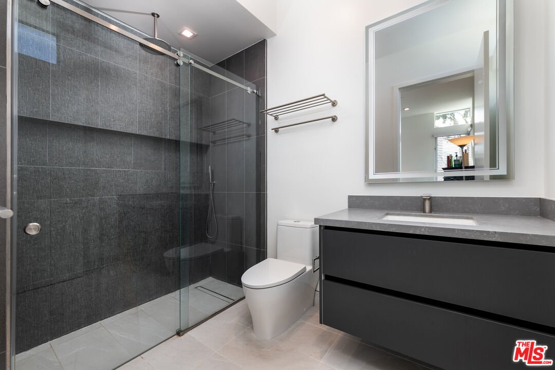 1951 Manning Avenue Los Angeles, CA 90025 - Photo 18 of 27 a bathroom with a sink a toilet and shower