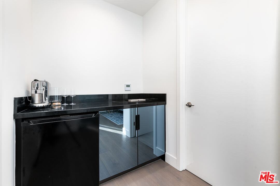 1951 Manning Avenue Los Angeles, CA 90025 - Photo 19 of 27 a kitchen with a sink and cabinets