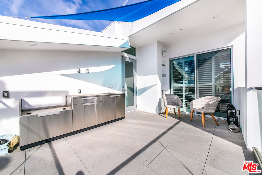 1951 Manning Avenue Los Angeles, CA 90025 - Photo 21 of 27 a living room with a table chairs and entryway