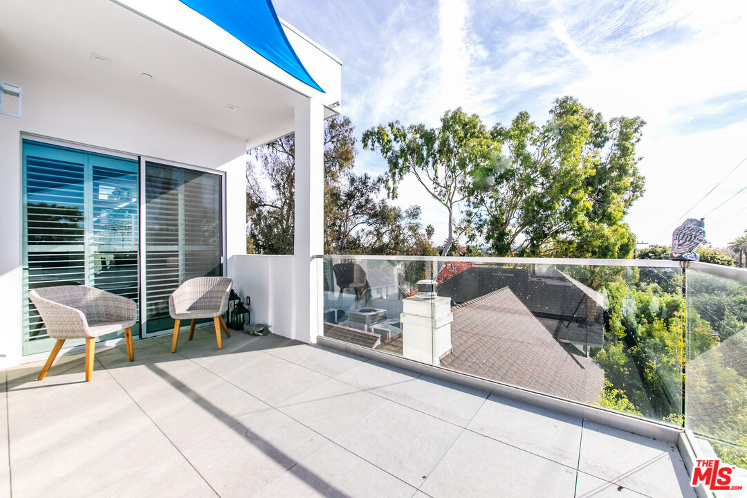 1951 Manning Avenue Los Angeles, CA 90025 - Photo 22 of 27 a roof deck with a couch and chairs