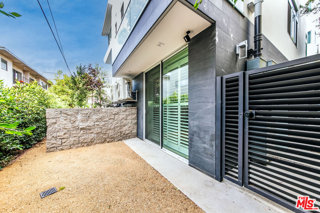 1951 Manning Avenue Los Angeles, CA 90025 - Photo 23 of 27 a view of a pathway along a building