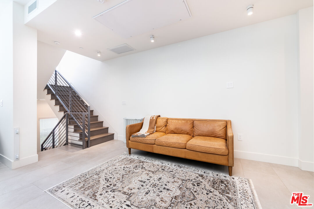 1951 Manning Avenue Los Angeles, CA 90025 - Photo 9 of 27 a living room with furniture and a rug