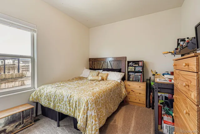 a bedroom with a bed and a closet