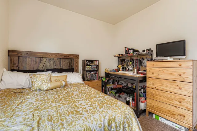 a bedroom with a bed and furniture