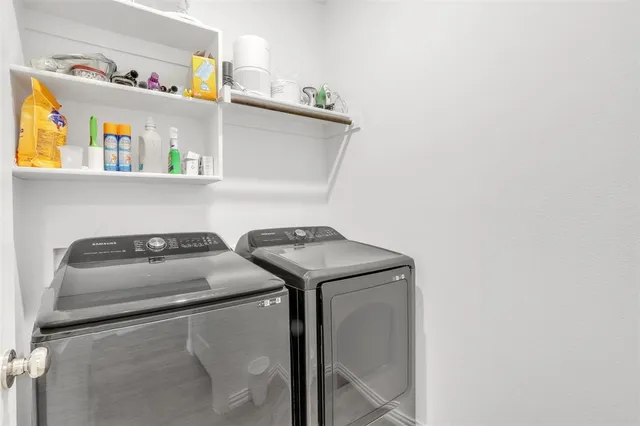 a utility room with dryer and washer