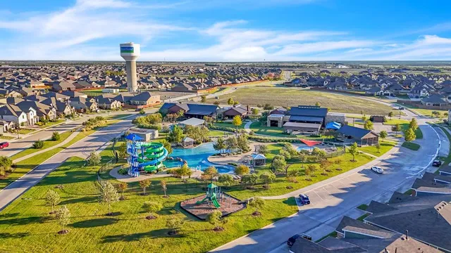 an aerial view of residential houses with outdoor space