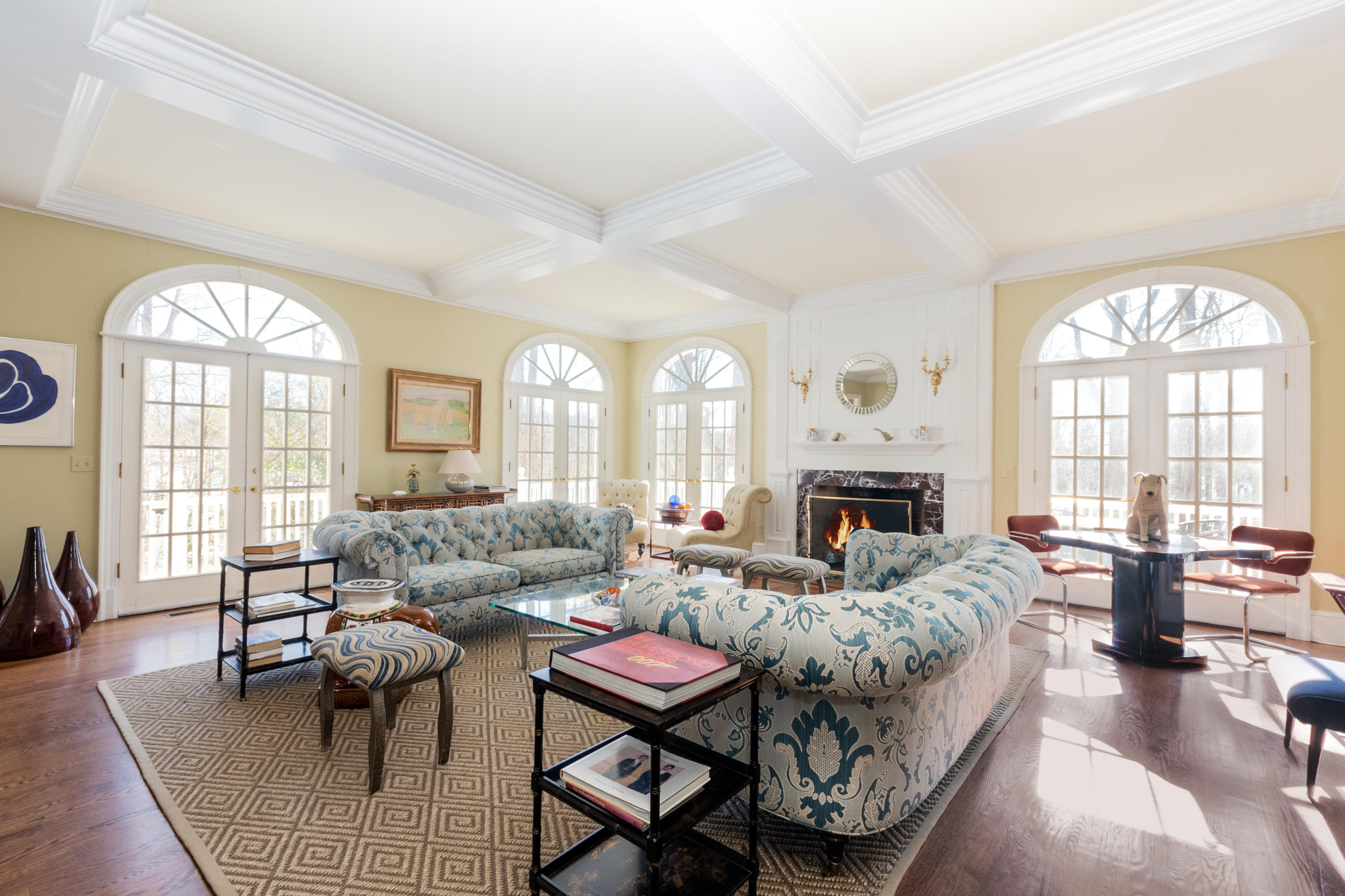123 Lone Tree Farm Road New Canaan, CT 06840 - Photo 5 of 26 a living room with furniture a fireplace and a large window