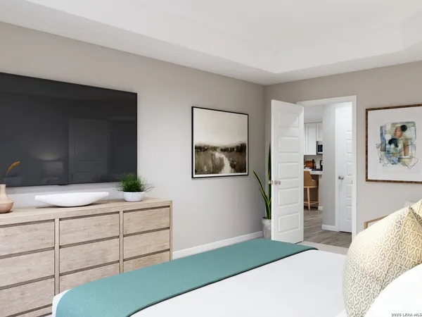 a bedroom with a bed and a dresser