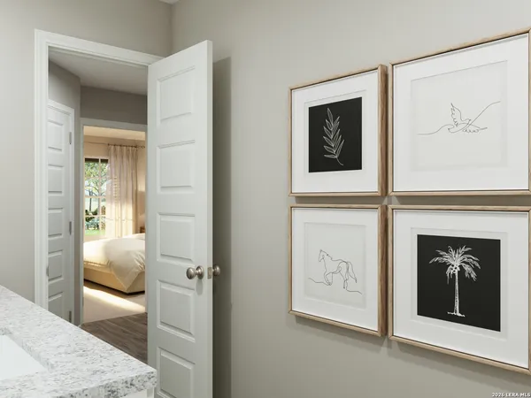 a hallway with painting and a table