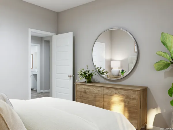 a bedroom with a bed and a mirror