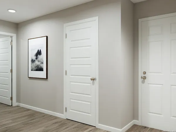 an empty room with wooden floor