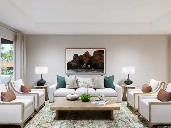 a living room with furniture and a lamp