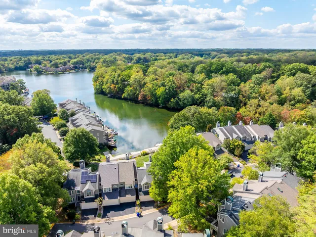 an aerial view of a house with a lake view
