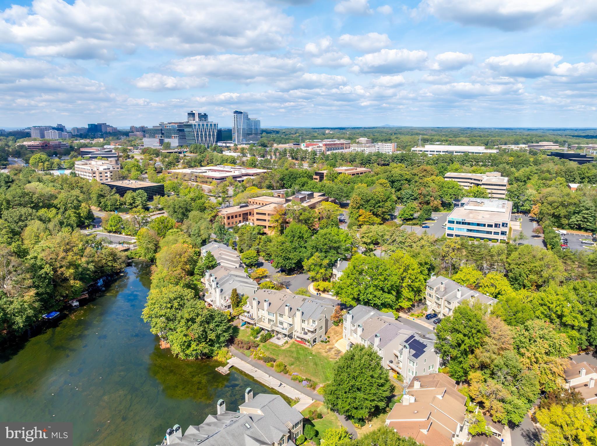 1933 Lakeport Way Reston, VA 20191 - Photo 2 of 57 a view of a lake with houses