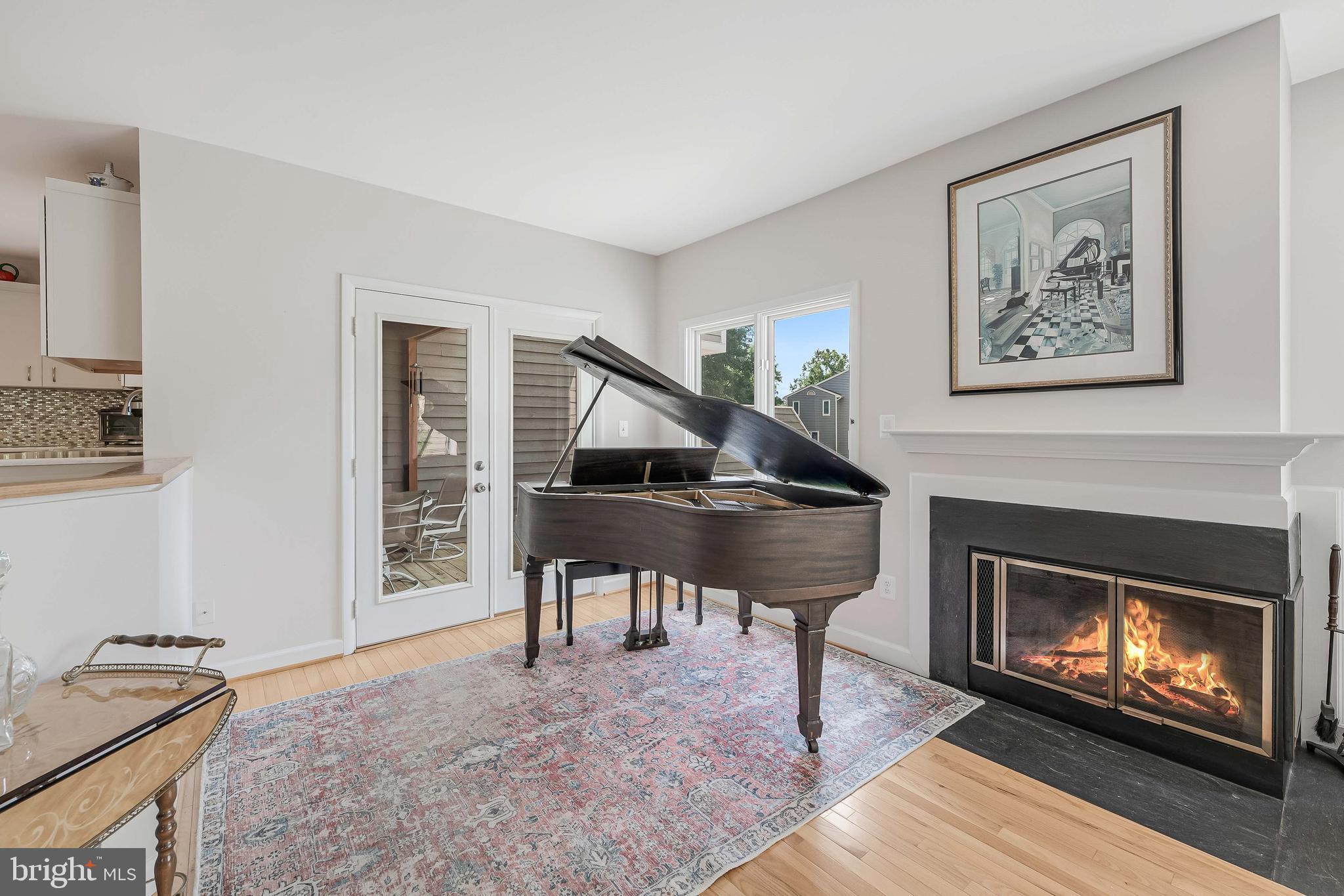 1933 Lakeport Way Reston, VA 20191 - Photo 21 of 57 a living room with furniture a fireplace and a window