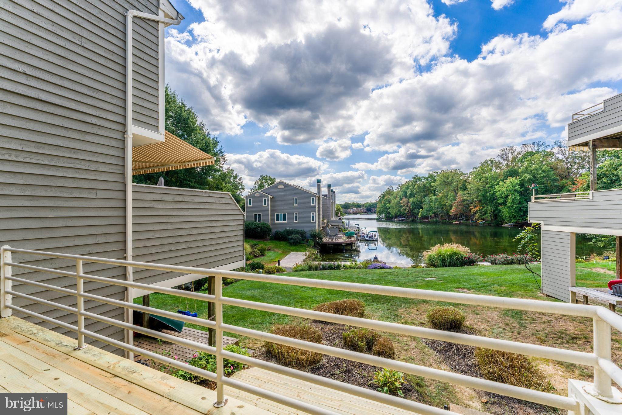 1933 Lakeport Way Reston, VA 20191 - Photo 24 of 57 a view of a house with a big yard and a large tree