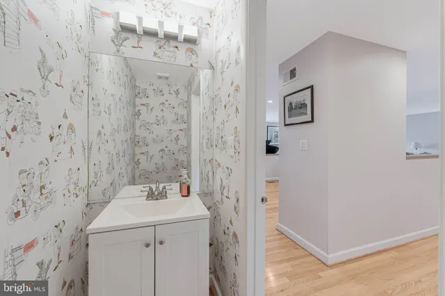 a bathroom with a sink and mirror