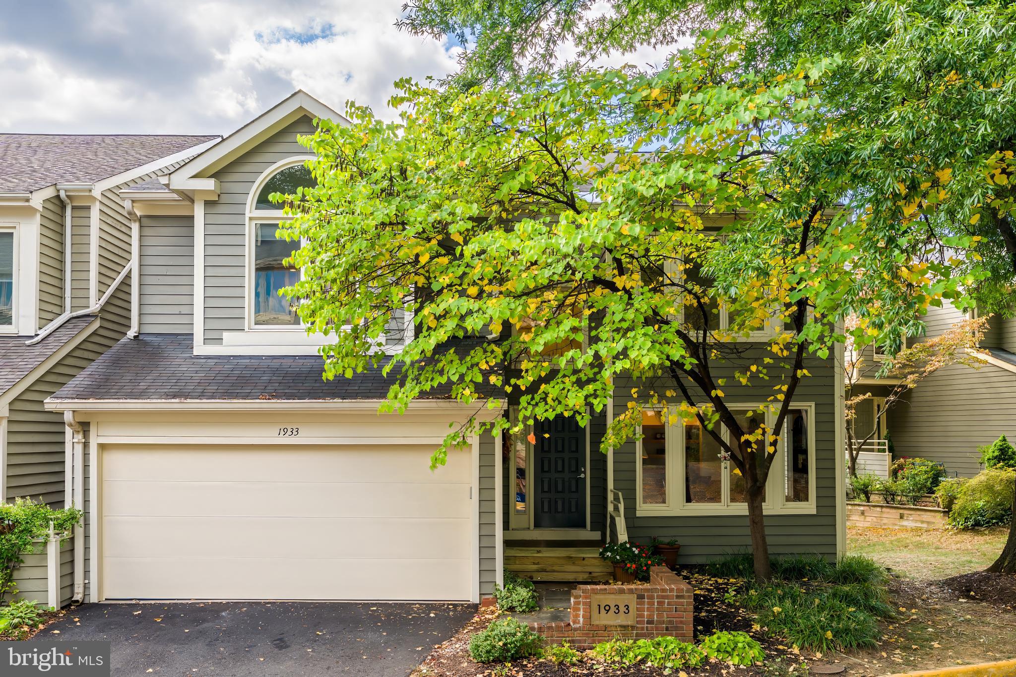 1933 Lakeport Way Reston, VA 20191 - Photo 3 of 57 a front view of a house with garden