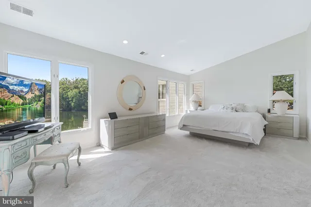 a view of a livingroom with furniture and a flat screen tv