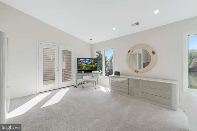 a bathroom with a shower tub and double vanity