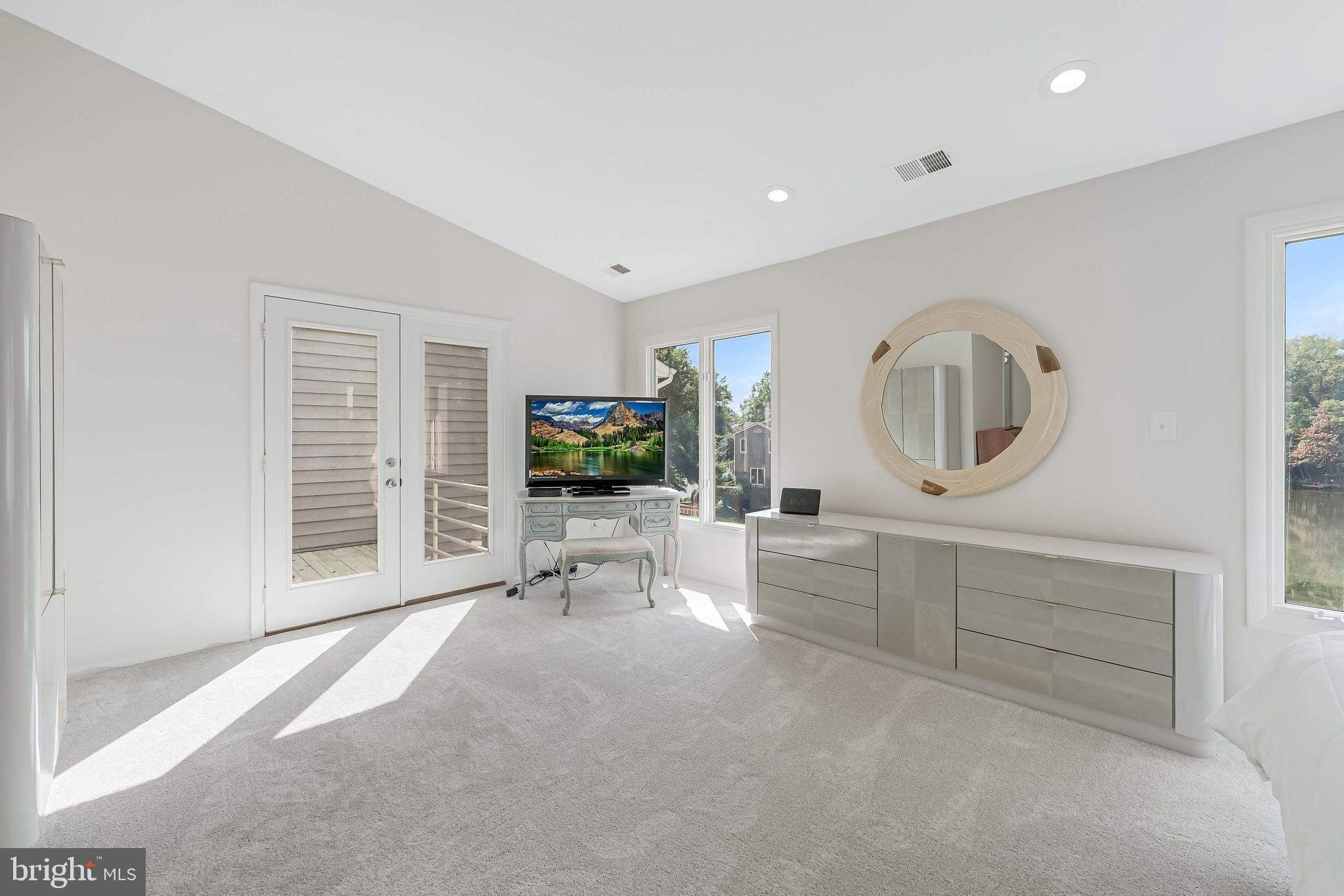 1933 Lakeport Way Reston, VA 20191 - Photo 33 of 57 a view of a livingroom with furniture and a flat screen tv
