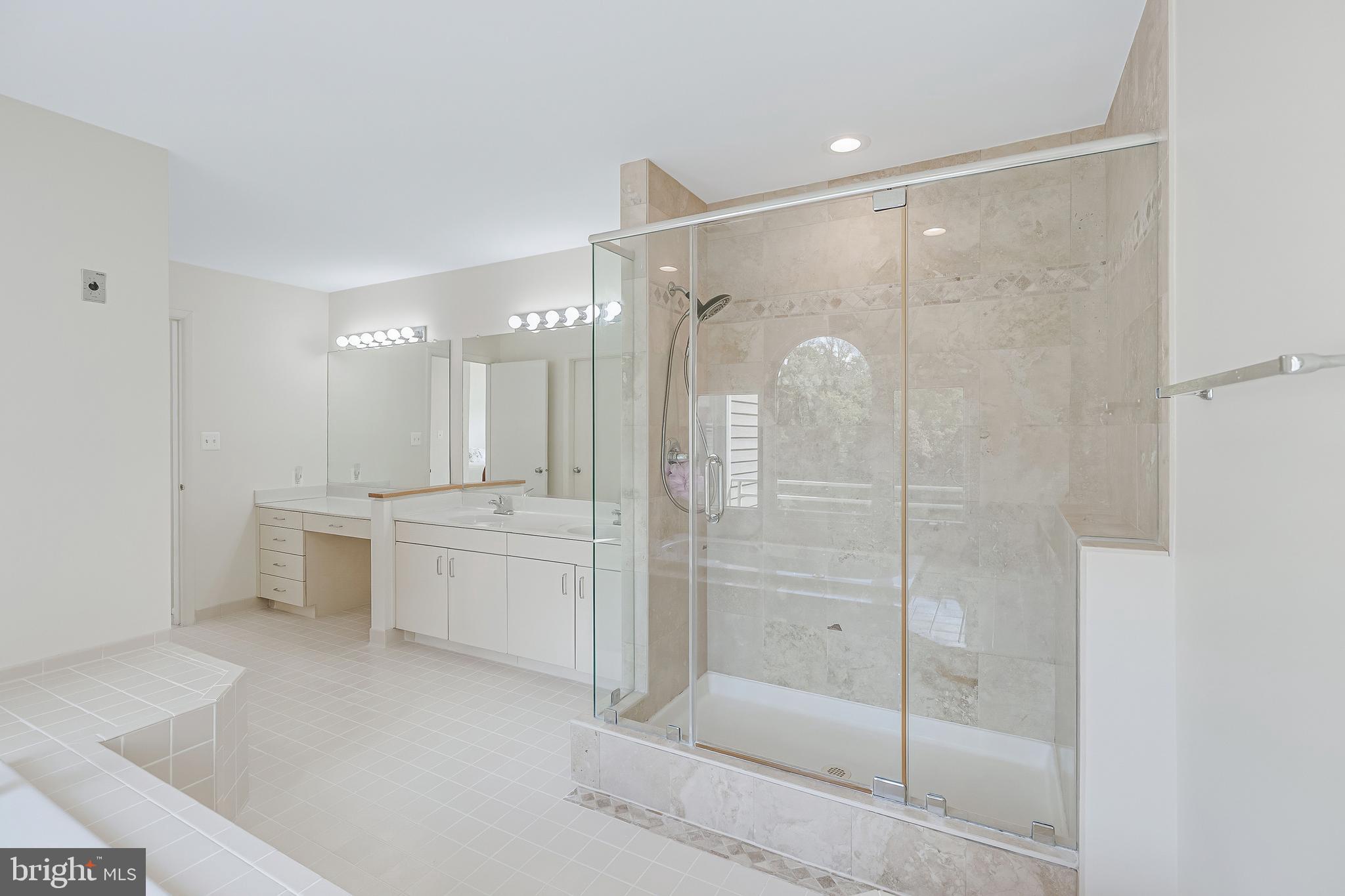 1933 Lakeport Way Reston, VA 20191 - Photo 36 of 57 a bathroom with a shower tub and double vanity