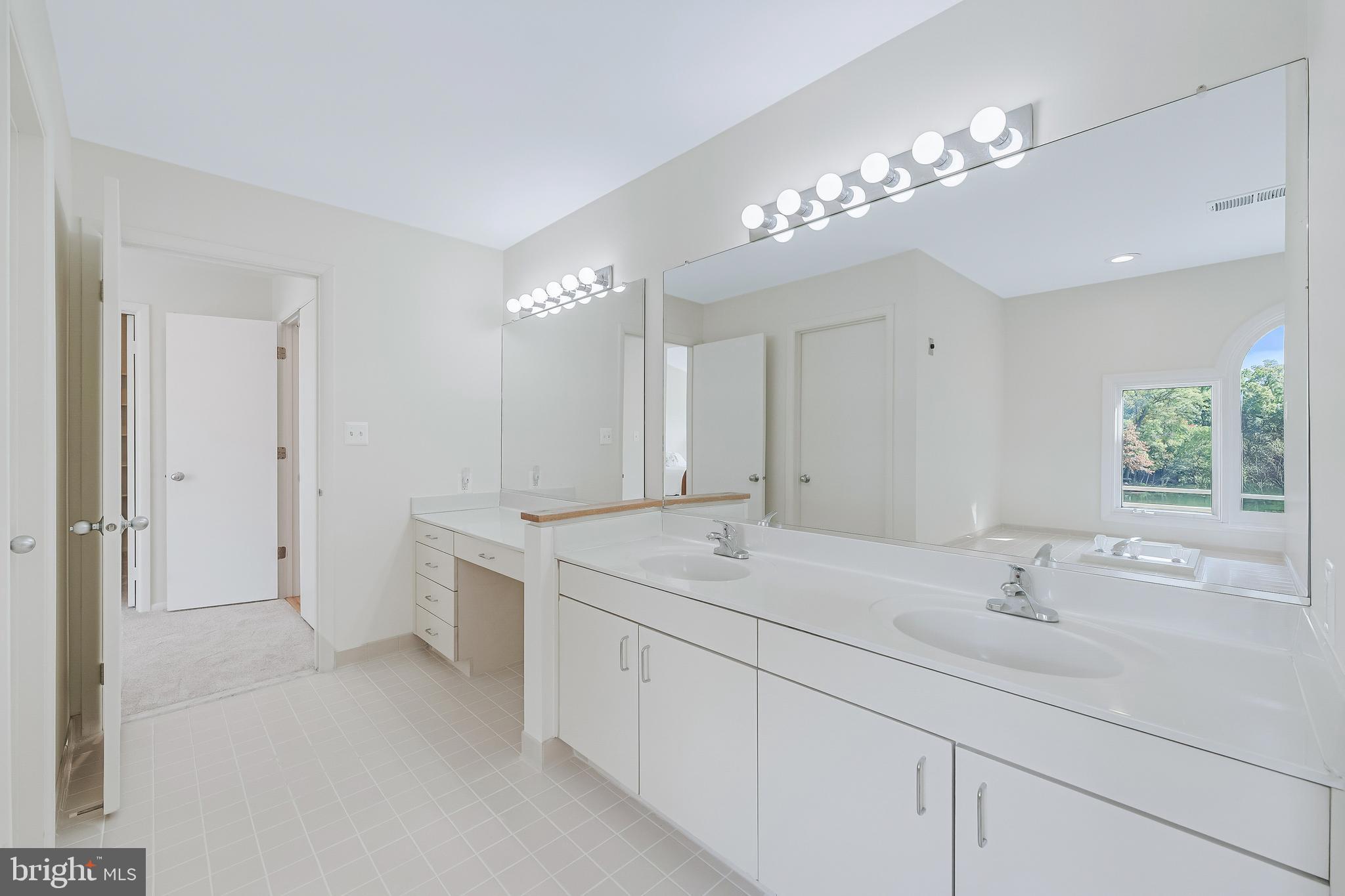 1933 Lakeport Way Reston, VA 20191 - Photo 38 of 57 a bathroom with a sink double vanity granite and a mirror