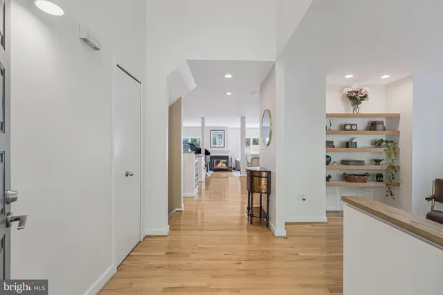 a view of a kitchen with kitchen island a counter top space cabinets and appliances