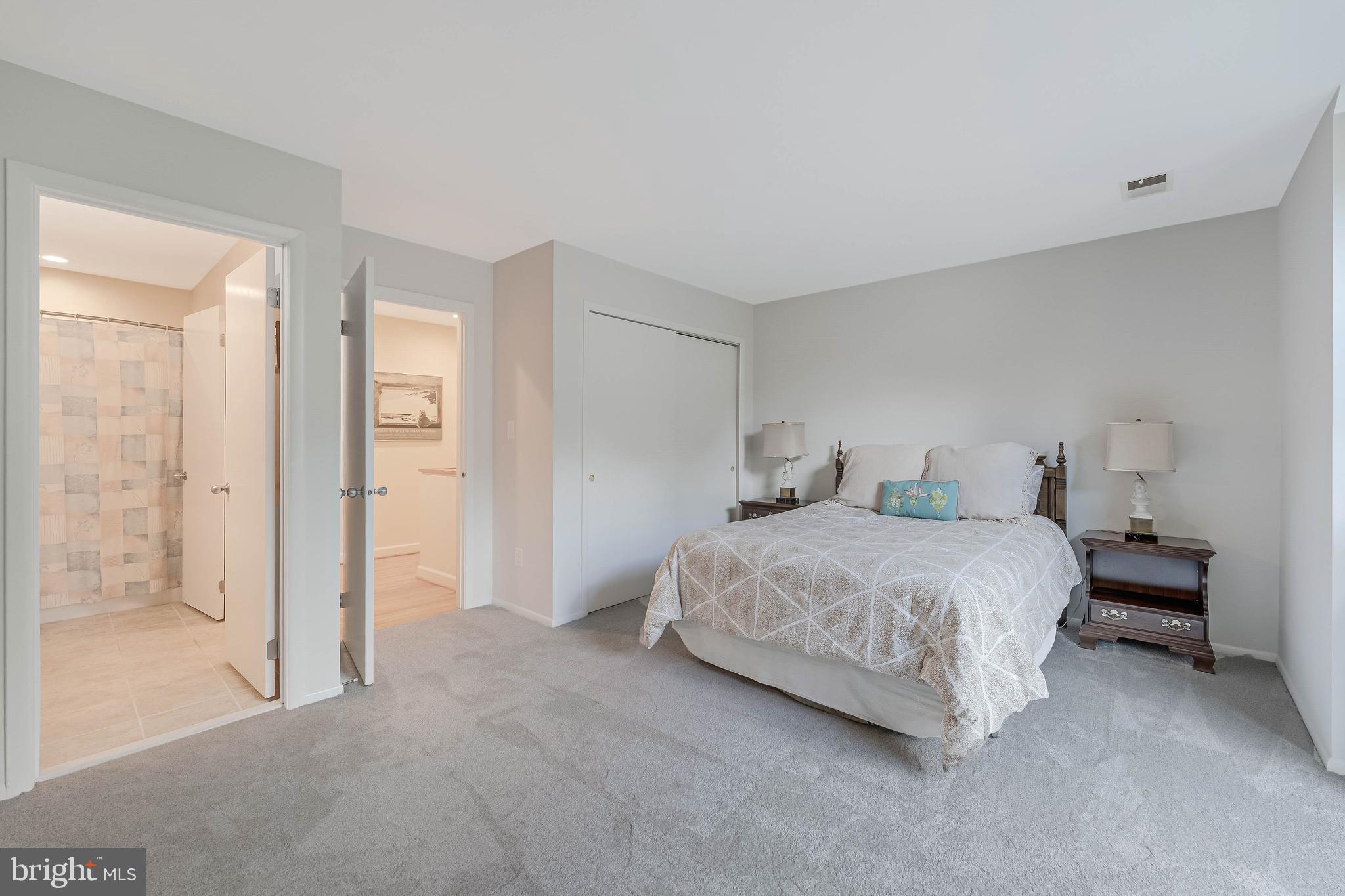 1933 Lakeport Way Reston, VA 20191 - Photo 49 of 57 a bedroom with a bed and a mirror