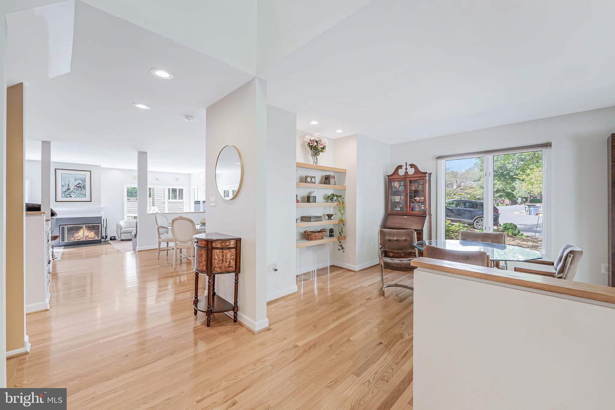 1933 Lakeport Way Reston, VA 20191 - Photo 5 of 57 a living room with furniture a fireplace and a large window