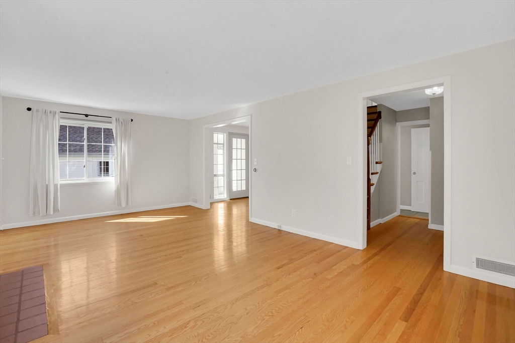 138 Abbott Street Springfield, MA 01118 - Photo 17 of 41 wooden floor in an empty room with a window