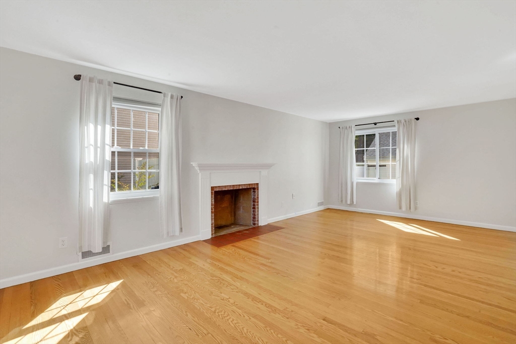 138 Abbott Street Springfield, MA 01118 - Photo 18 of 41 a view of empty room with wooden floor and fireplace