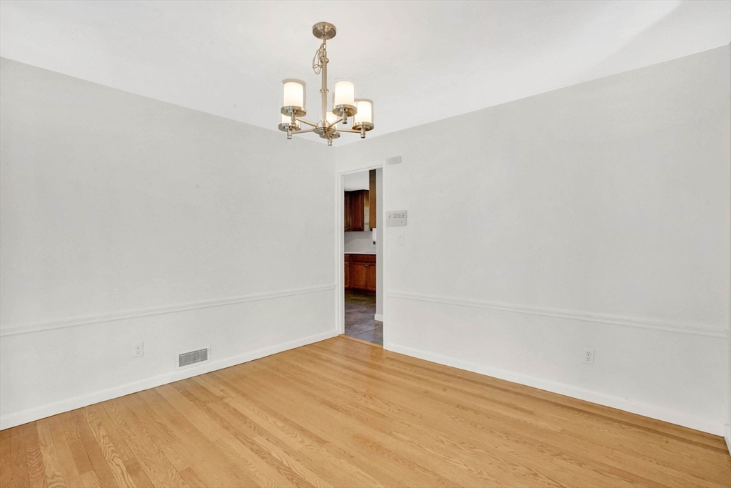 138 Abbott Street Springfield, MA 01118 - Photo 19 of 41 a view of a livingroom with a chandelier fan and wooden floor