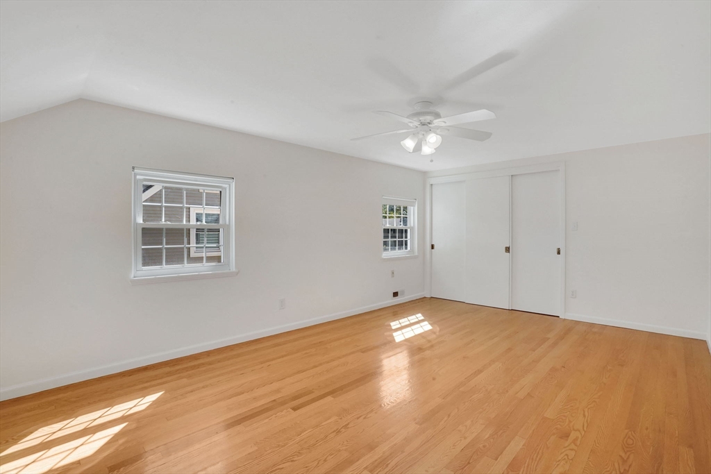 138 Abbott Street Springfield, MA 01118 - Photo 23 of 41 a view of an empty room with chandelier fan and fire place