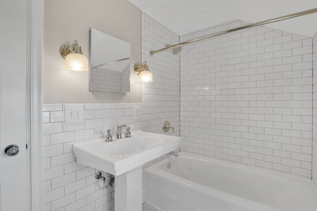 138 Abbott Street Springfield, MA 01118 - Photo 29 of 41 a bathroom with a sink and a bathtub