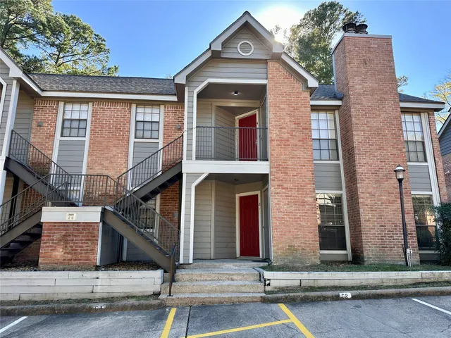 a front view of a house with garage
