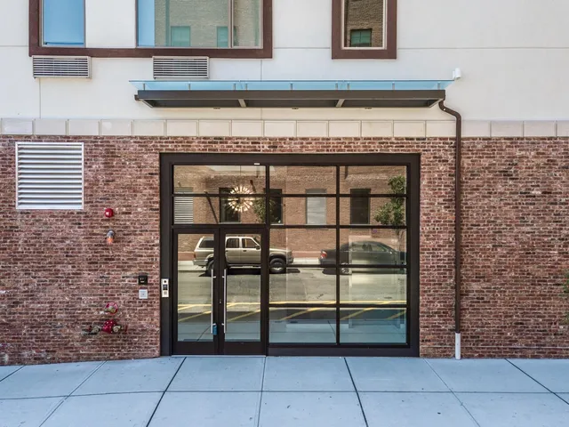 a view of a building with sitting area
