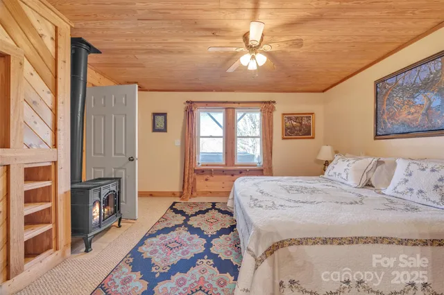 a bedroom with a bed dresser and a window
