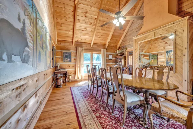 a dining room with furniture and wooden floor
