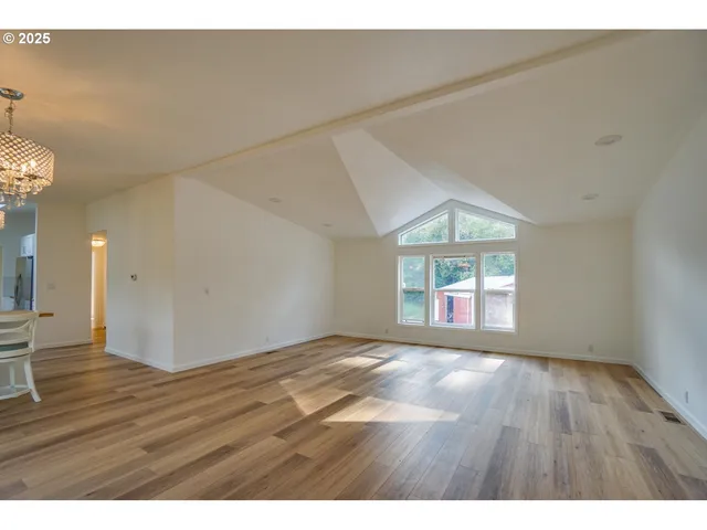 a kitchen with kitchen island a stove and a wooden cabinets