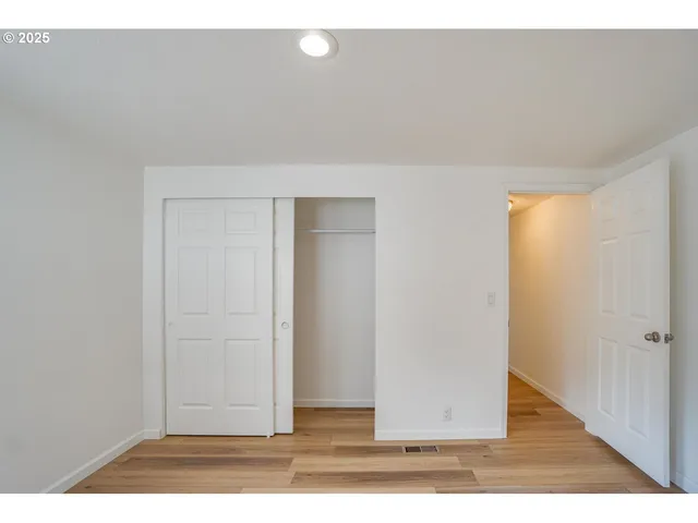 a bathroom with a double vanity sink mirror and shower