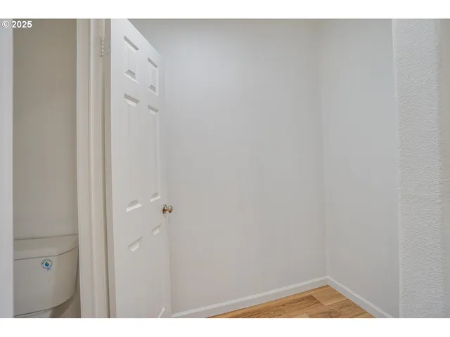 a view of a room with wooden walls
