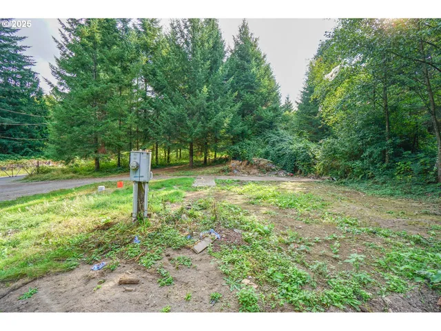 a kitchen with granite countertop a stove a sink and a refrigerator