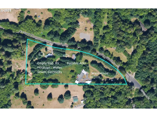 a view of a big yard with lots of green space