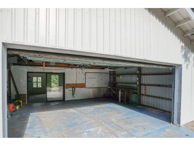 a view of an empty room with a fireplace